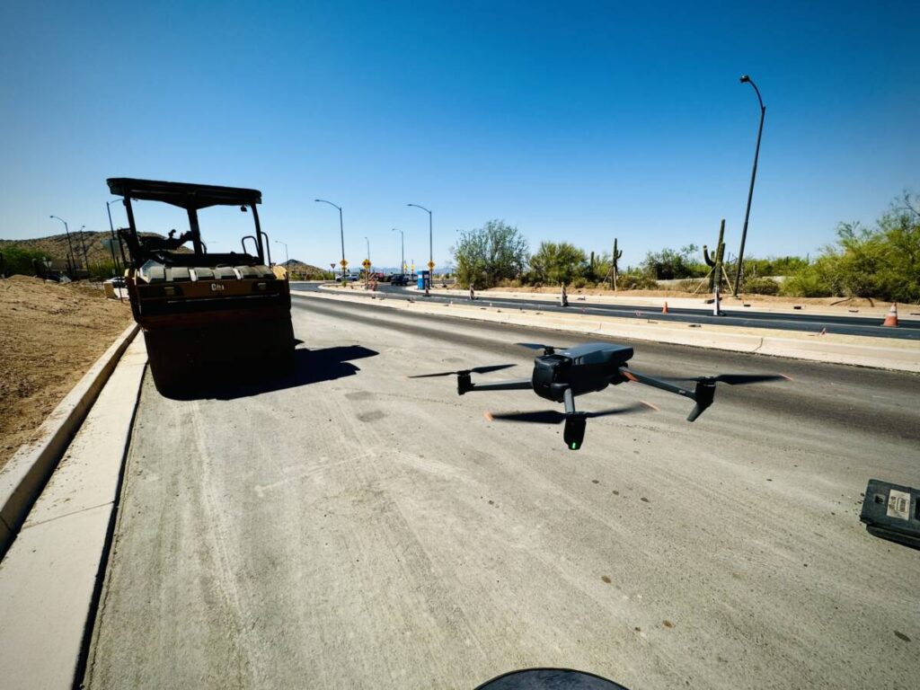 Drone launching from a construction site, ready to shoot footage of the project.