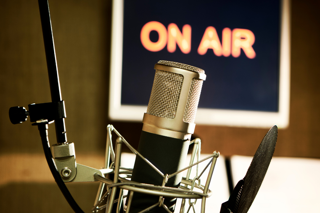 A microphone represents the increased influence of AI and media mentions on strategic communications.